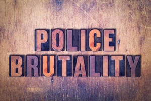 The words Police Brutality concept and theme written in vintage wooden