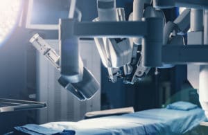 Surgical room in hospital with robotic technology equipment, machine arm surgeon in futuristic operation room. Minimal invasive surgical inoovation, medical robot surgery with 3D view endoscopy